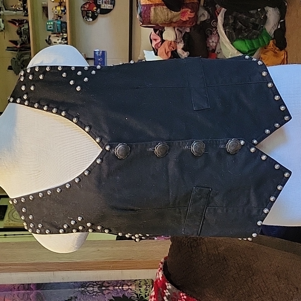 Black cotton and metal stud vest with metal buttons.
